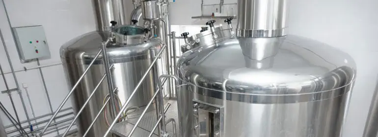 Tanques de acero inoxidable: Usos, tipos y beneficios 1 Tanques de acero industrial usados para la industria alimentaria
